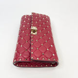 VALENTINO ROCKSTUD CROSSBODY/ CLUTCH  IN RED LMBSKN LEA & GHW