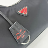 PRADA RE EDITION 2005 CROSSBODY IN BLK NYLON & RED HW