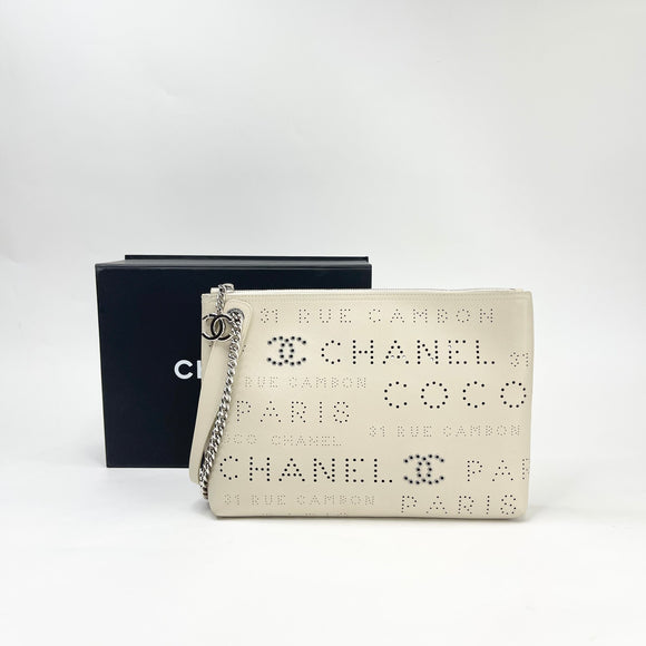 PRE LOVED CHANEL LIMITED EDITION EYELETS CREAM LEA & SHW CLUTCH